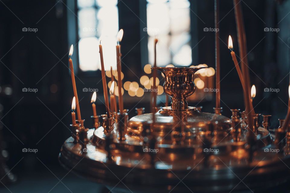 church candles lights against bokeh background