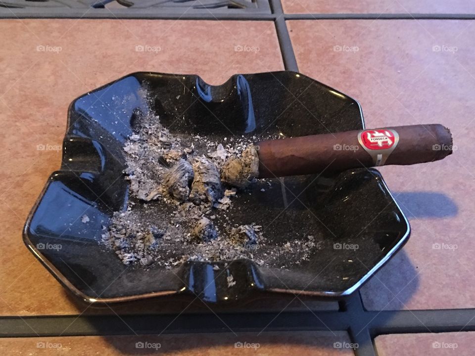 Burning cigar.
