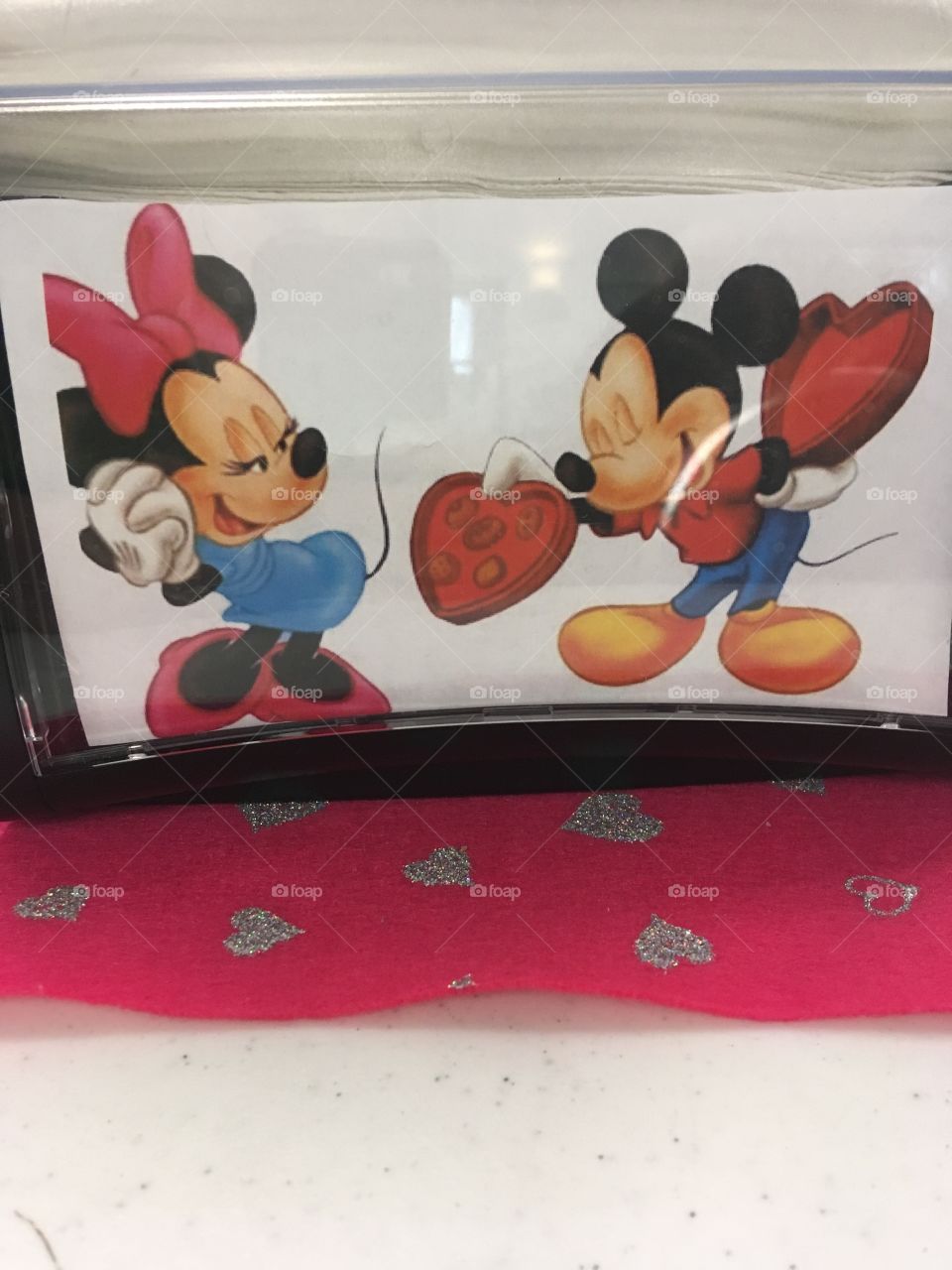 Minnie and Mickey celebrating Valentine’s Day in style. We place Holiday pictures in our napkin holders.