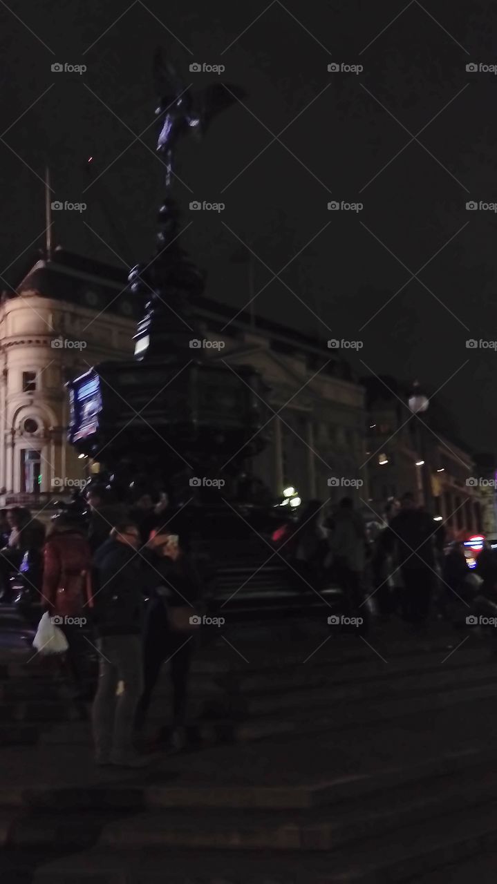 Piccadilly circus always busy and lively. London by night. Weekend about to start