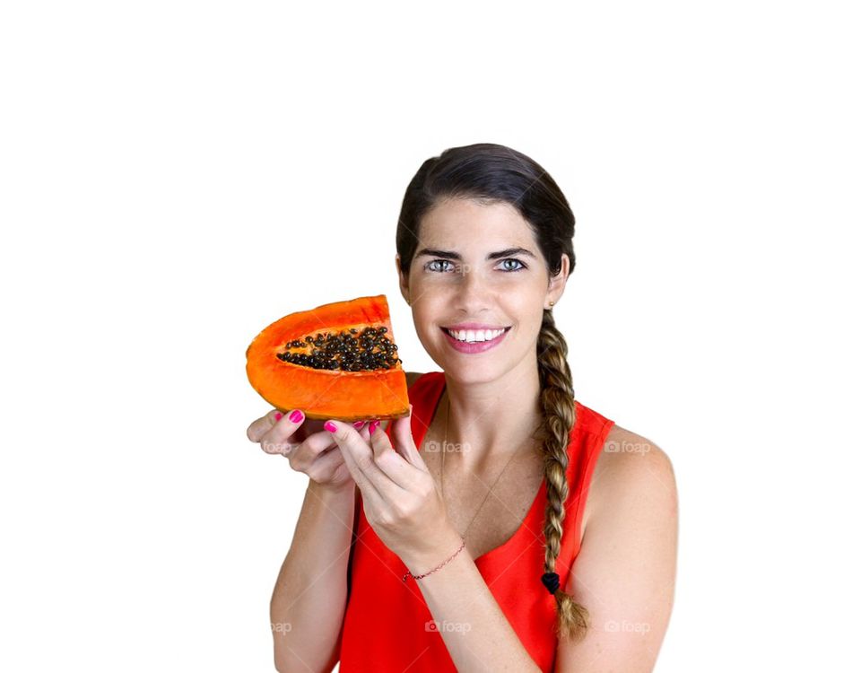 Beautiful girl showing a Papaya