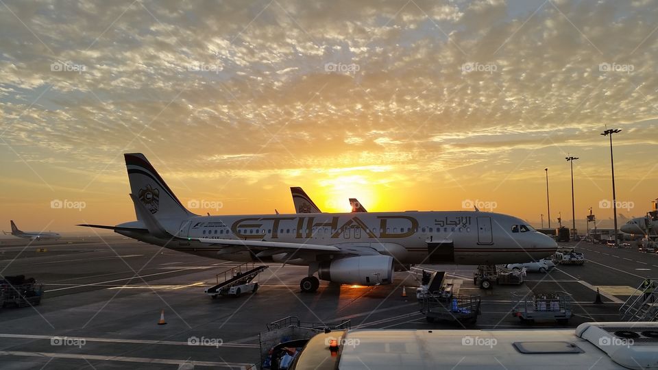 Plane at the sunrise