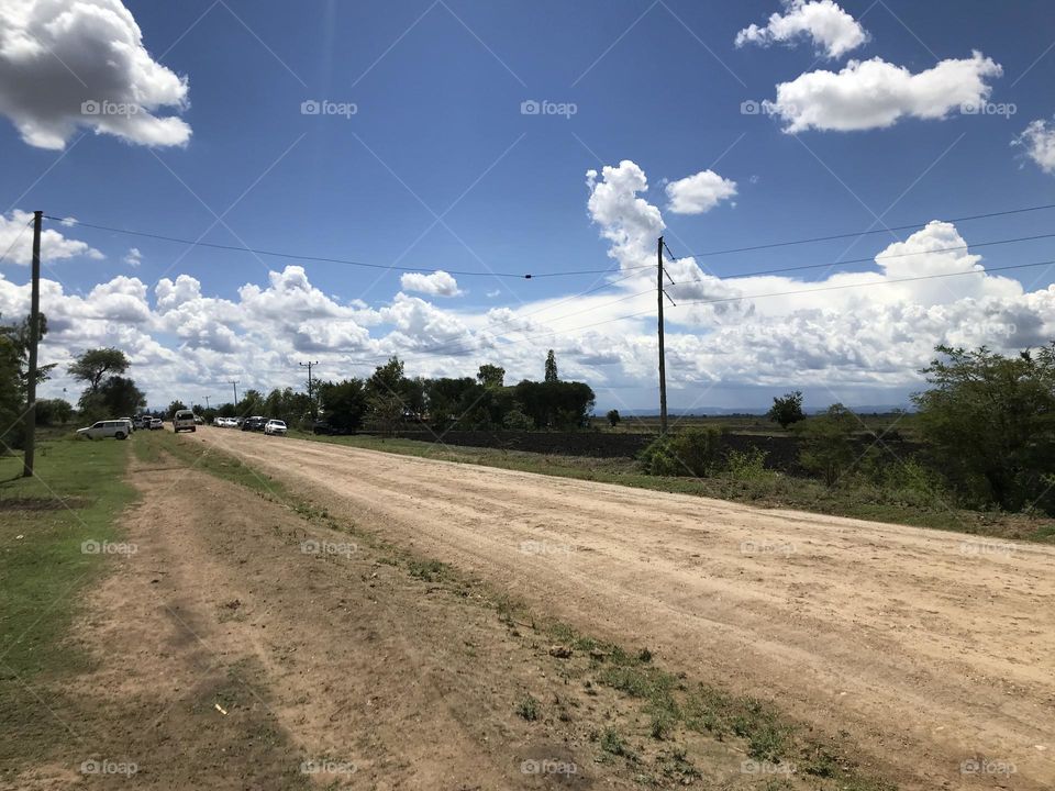 sky Cloud Road landscape Field environment Nature rural area Transportation Plant electricity Tree