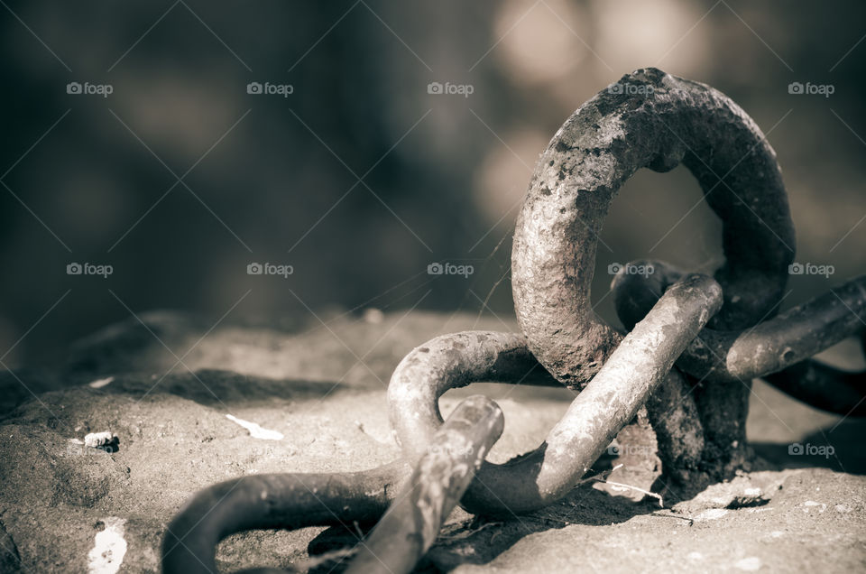 Close up of rusted chain links in monochrome. Beautiful background.