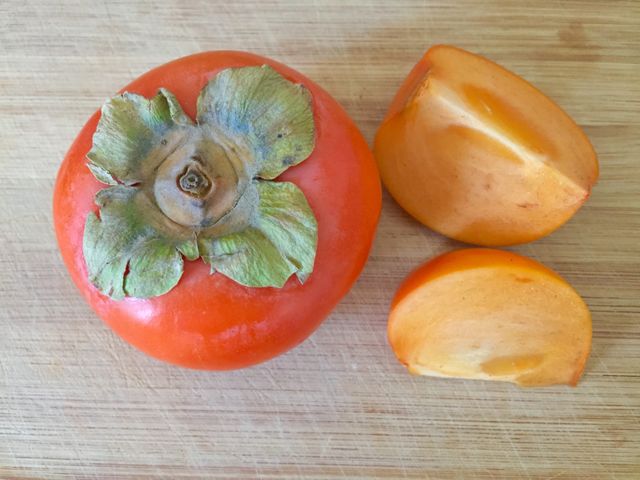 Persimmon on bamboo board 