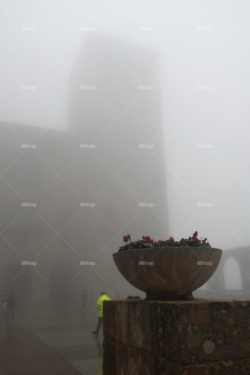 A medieval tower in the fog