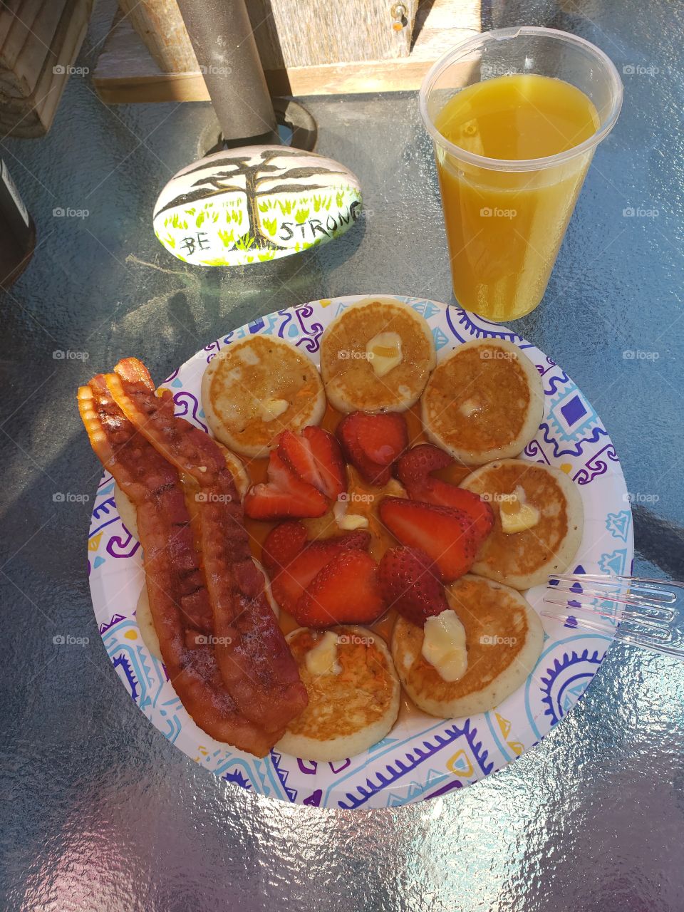 Be strong with a great breakfast.  pancakes,  fruit,  bacon and a glass of orange juice.   it's perfect to fuel your body.