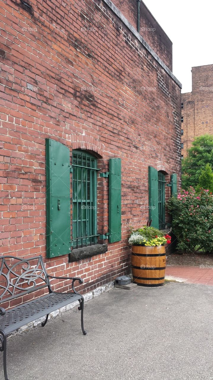 shuttered window at distillery