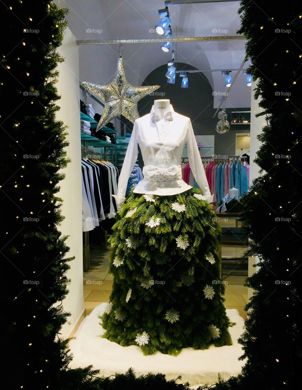 Winter fashion on a mannequin consisting of skirt made of branches in a shop