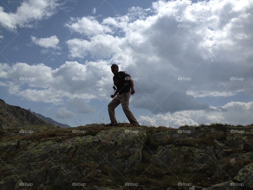 Man on the hill. Hill at Dolomiti, Italy