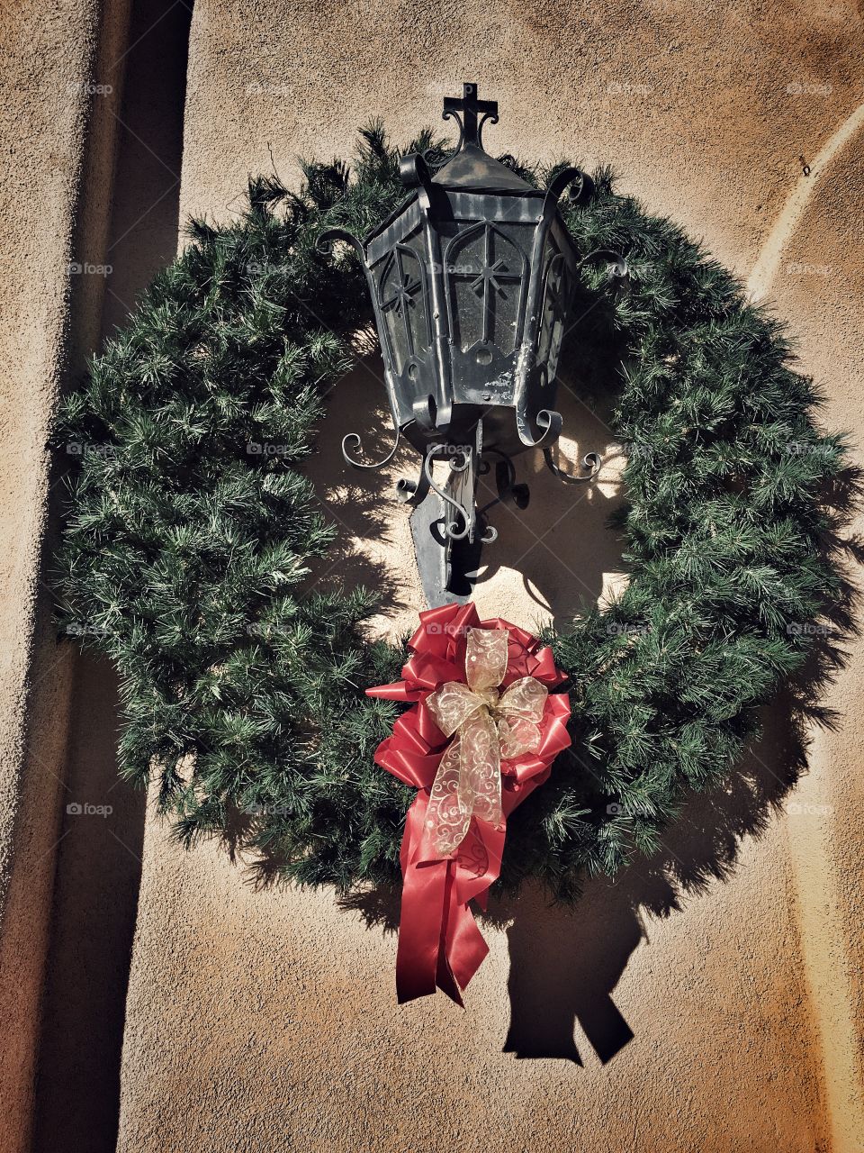 Wreath on adobe church