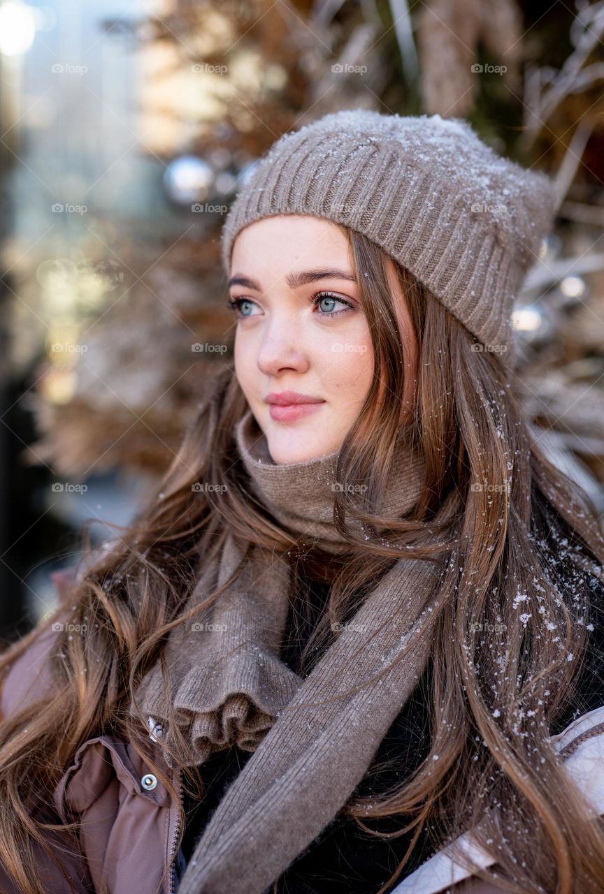 Winter fashion. Portrait of beautiful girl in knited hat
