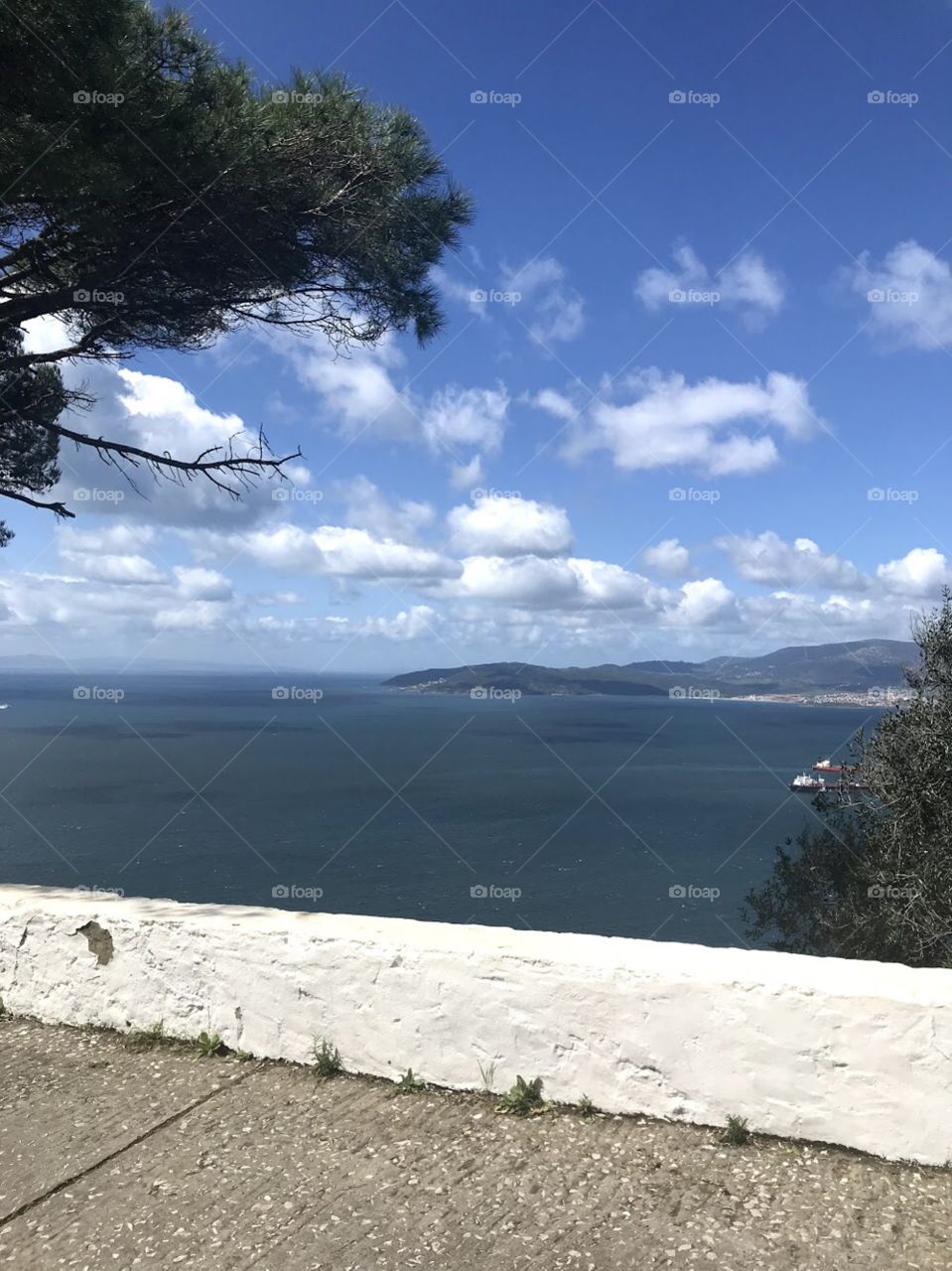 View of Africa from Gibraltar with water and blue sky clouds 