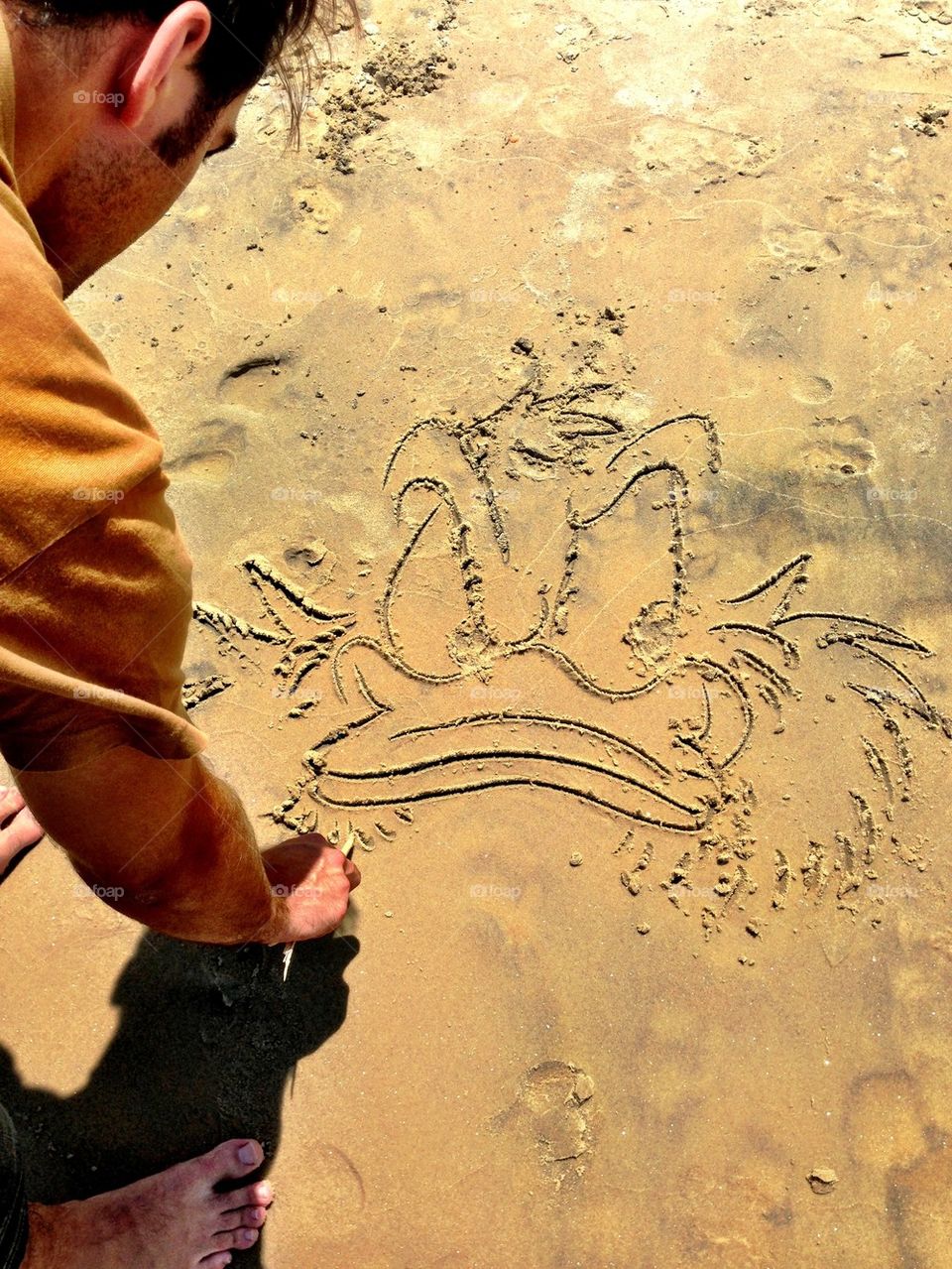 Draw a cartoon on the sand!