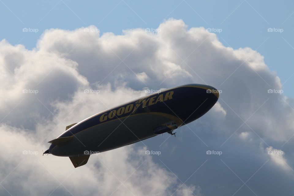 Look up at good year blimp in sky