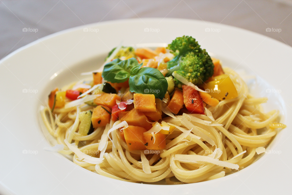 Noodles with some vegetables and Parmesan 