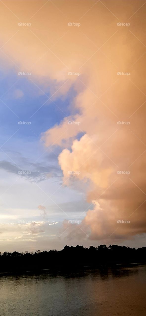 sun giving clouds an orange glow