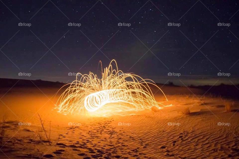This warm and exciting light painting long exposure photo is sure to ignite passion is whatever you do. The lines and energy within this piece will carry over into any eye of whom beholds it.