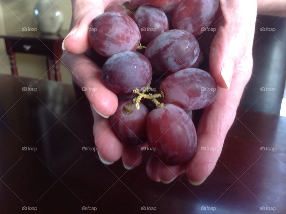 A handful of juicy red grapes.