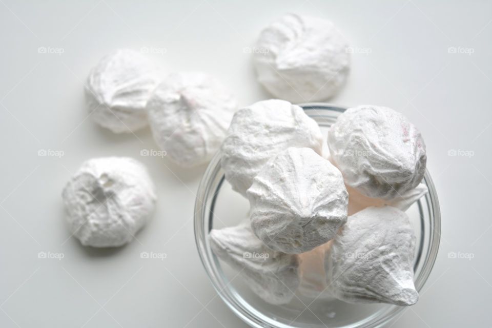 sugar meringues on a white background top view