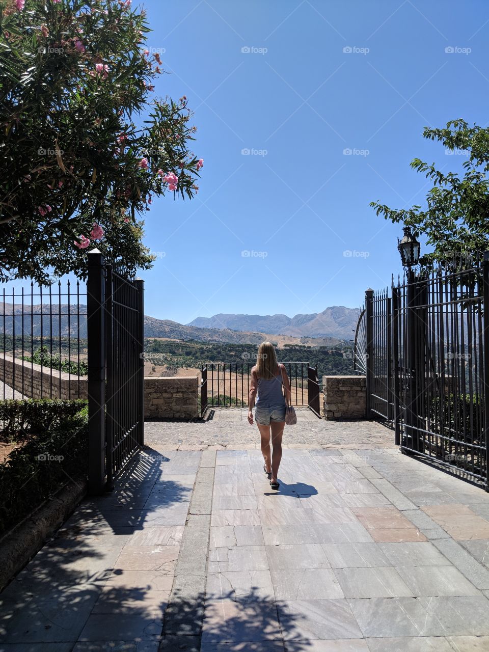 woman walking to stunning lookout in Spain