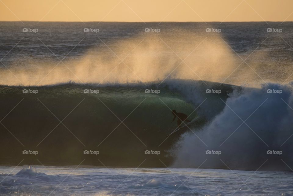 Surfer at sunset