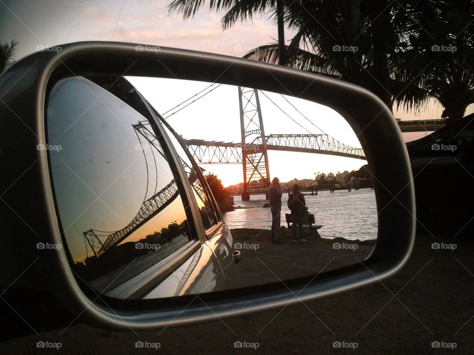 Florianopolis bridge viewed from car mirror
