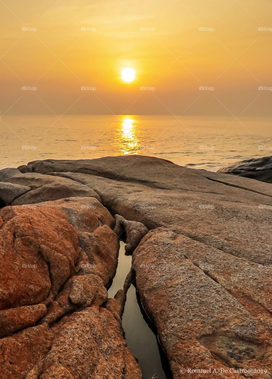 Sunrise Caught at the East Coast of Macau SAR.. with colorful and Ample rock Formations at the coastline..Good spots for Sunrise chasing in Macau island.. Long Chao Kok Coastal Trail!