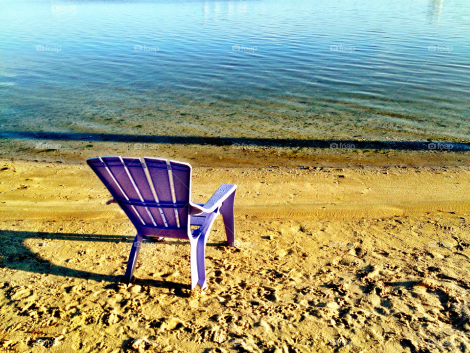 beach chair purple water by bcpix