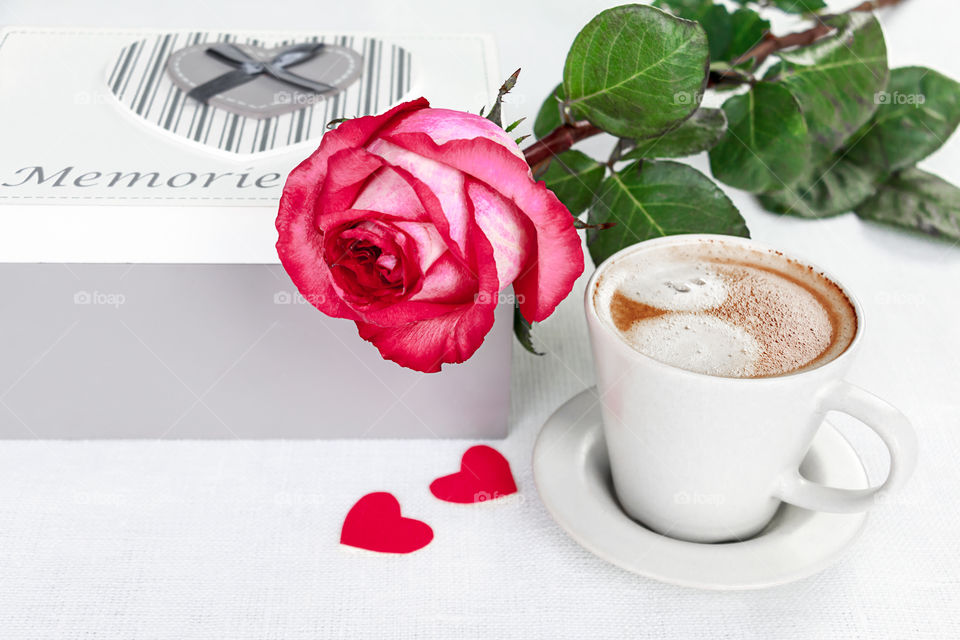 rose and cup of coffee