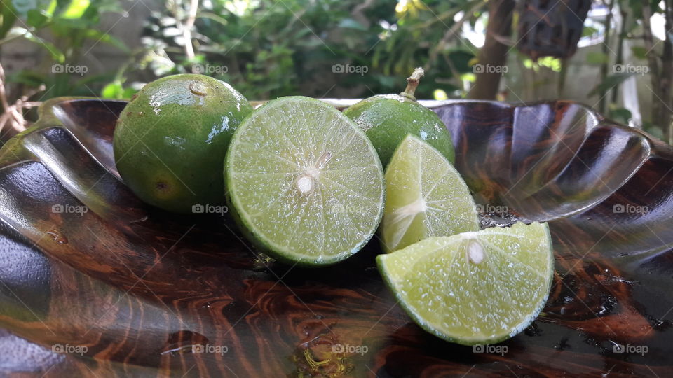 lime  fruit on  wooden  plate