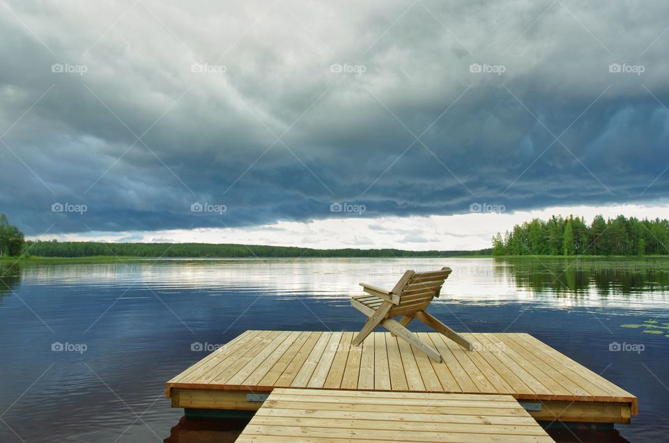 Empty chair on pier