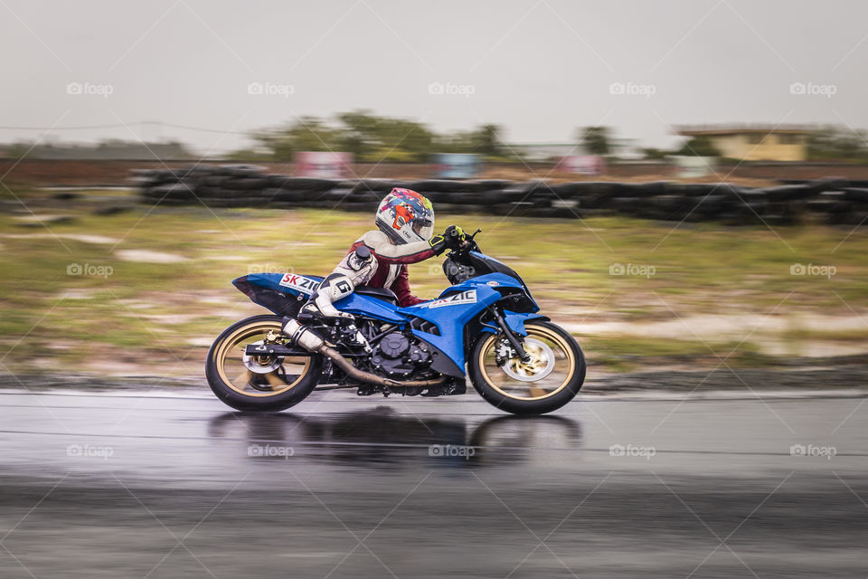 PHNOM PENH, CAMBODIA - Aug 20, 2017: 110 CC engine racing after rain