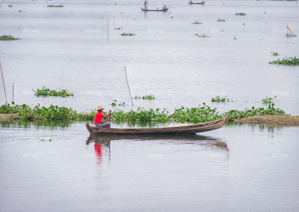 Local life style of fisherman in Early morning at Uben bridge , the longest wooden bridge in the world.