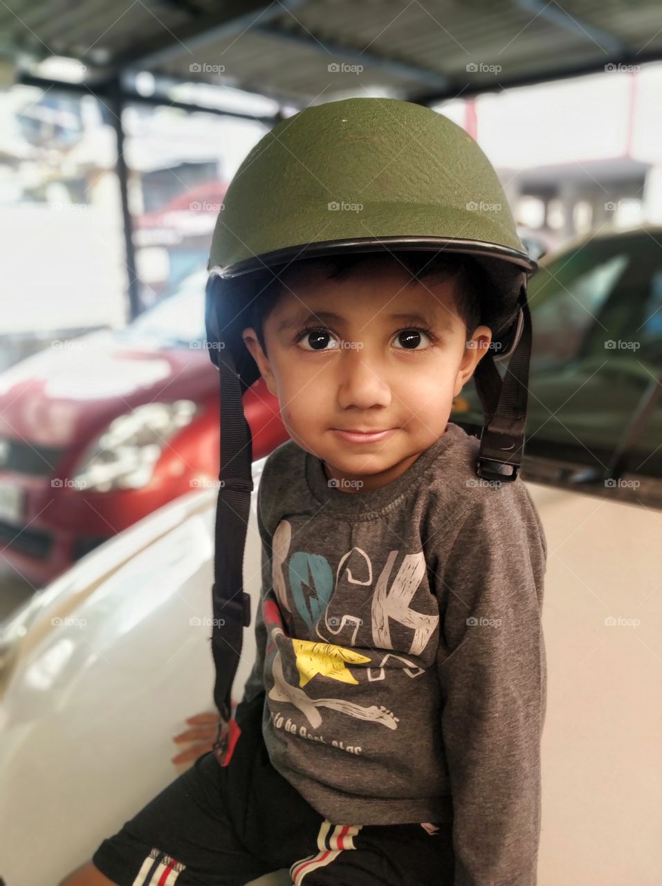 Kid is getting ready for a terrain ride in India 2018.