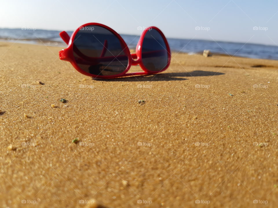 glasses on the beach