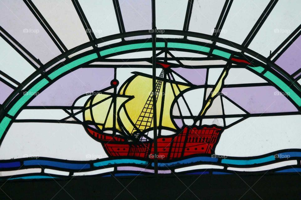 stained glass ship at sea