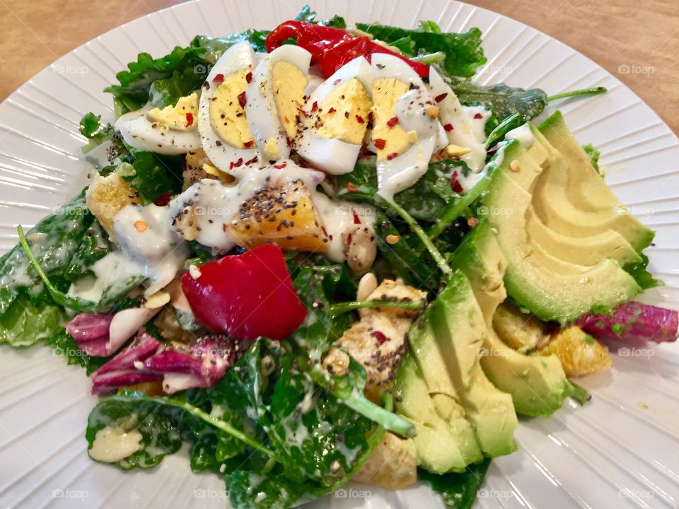 Homemade organic Salad 
Baby Kale with Chia seeds, Almond Flakes, Roasted Peppers, Avocado, 1hard boiled Egg with Cilantro Lime Yogurt dressing 