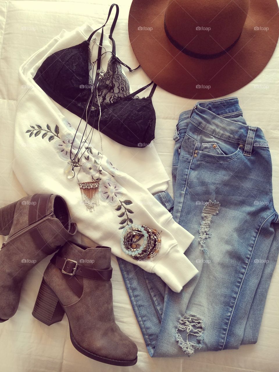 flat lay clothes jeans shirt hat boots