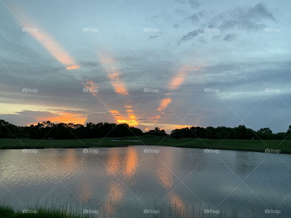 Sun rays over lake