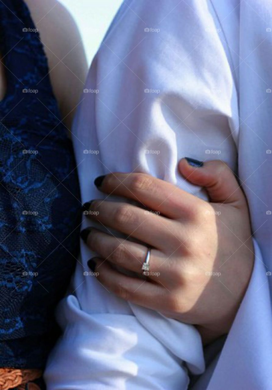 Up close shot to see the engagement ring.