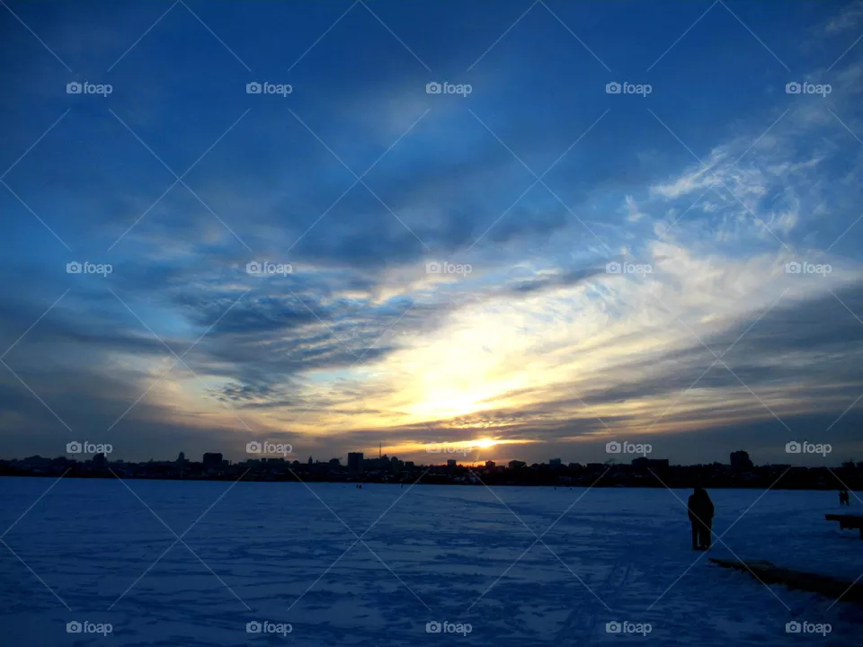 severe winter sky, sunset over the city, frost