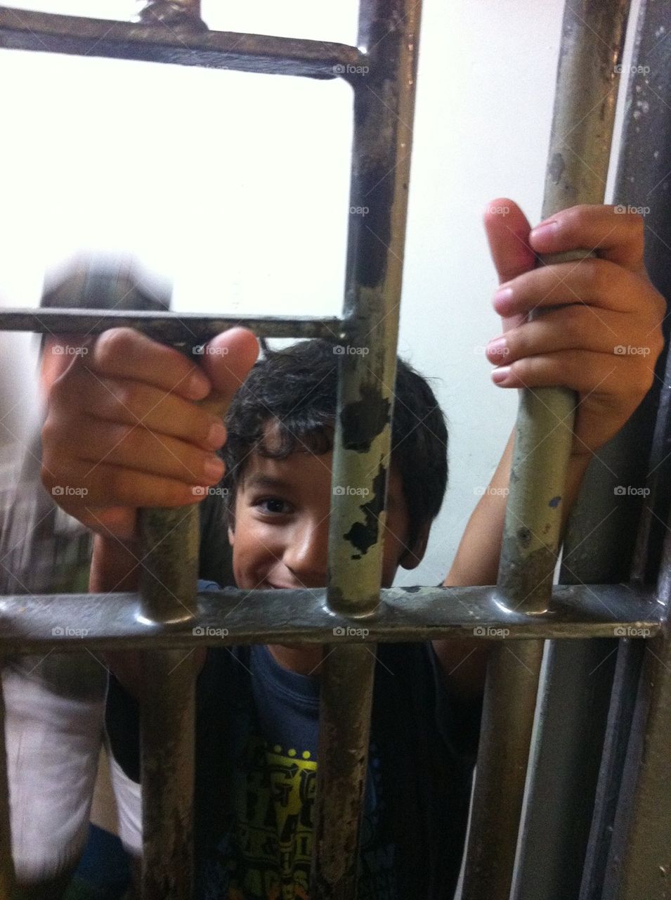 Boy behind bars