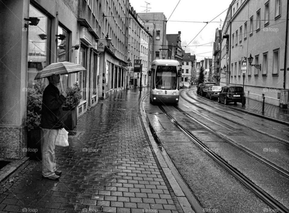 Man waiting for Augsburg Tram
