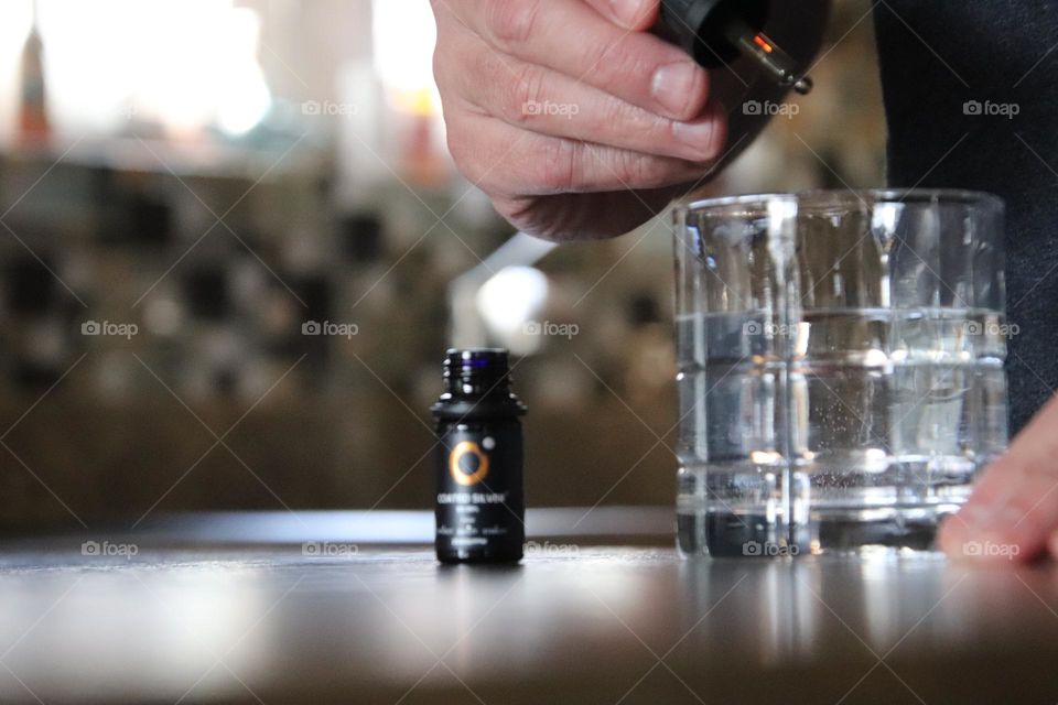 Man holding coated silver product 