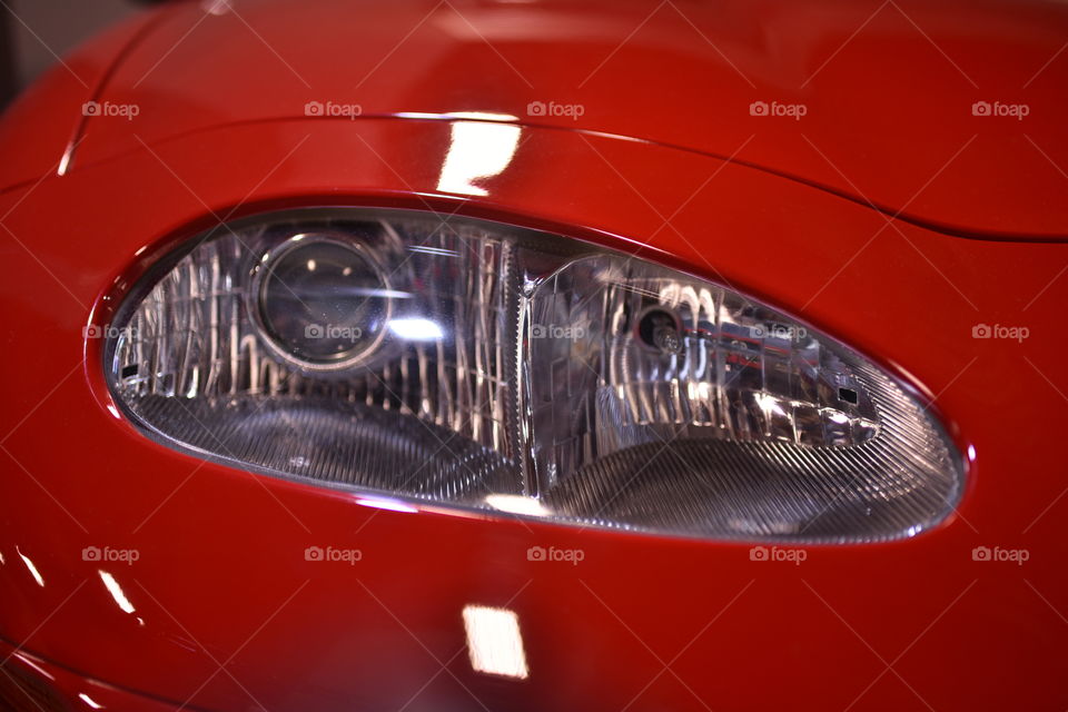 Headlight on a red car