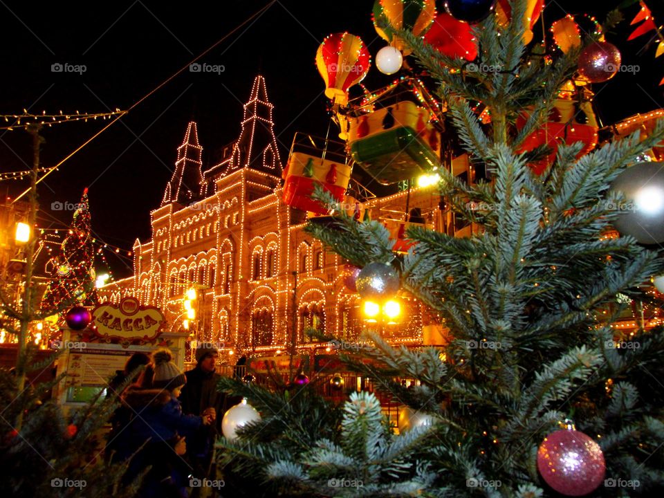 Happy New Year and Merry Christmas. Christmas decorations. Fir branches, shiny balls, garlands, lights and lanterns. gingerbread, dried fruits, nuts. Preparing for Christmas at home and on the streets.
