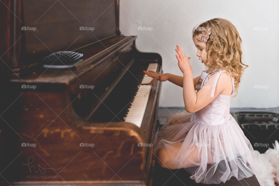 Girl in tutu at piano