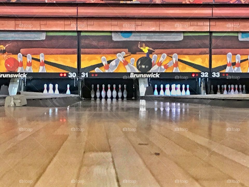 Floor view of bowling pins in bowling alley