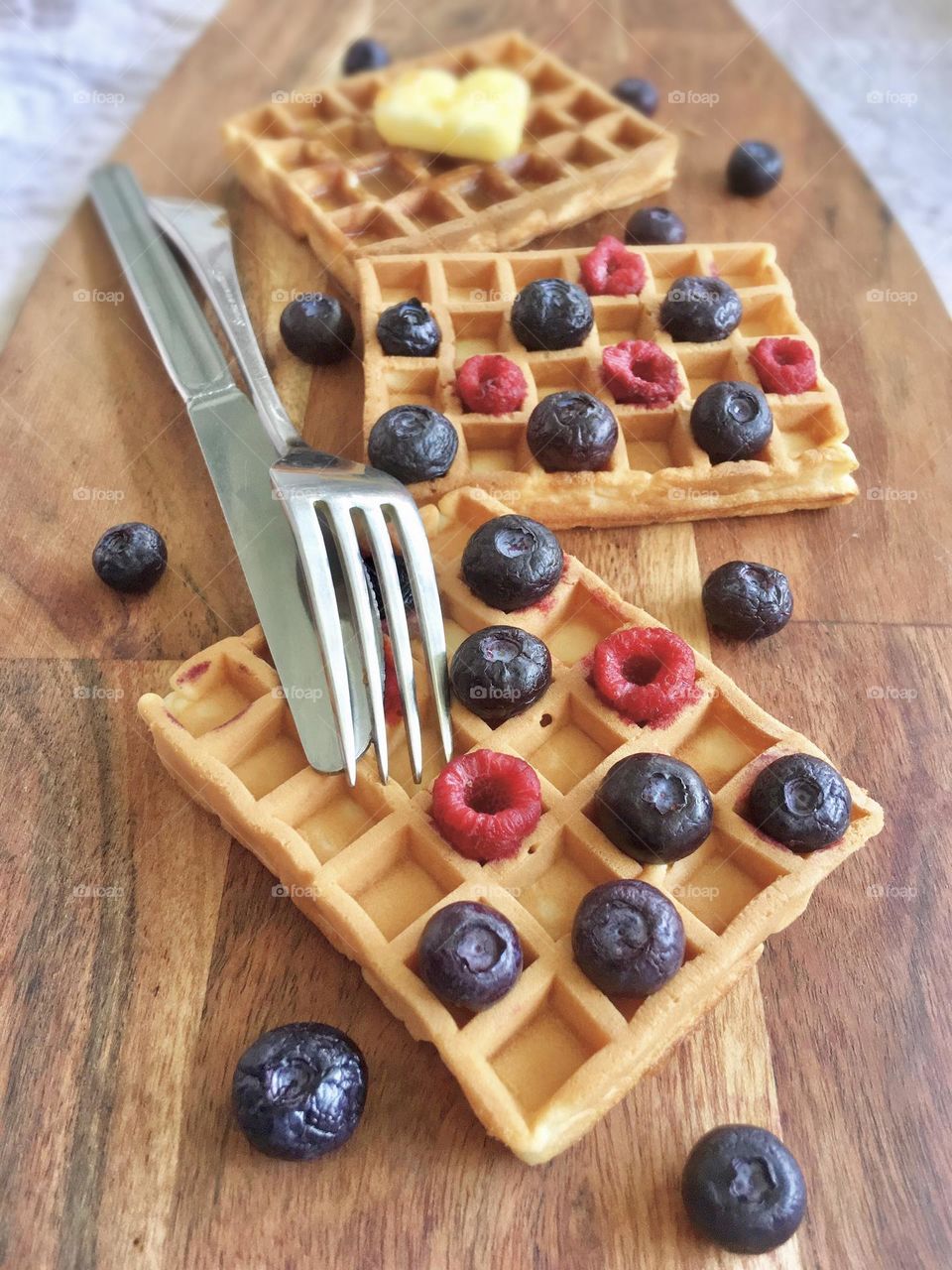 Summer treats; mini waffles with raspberries and blueberries 